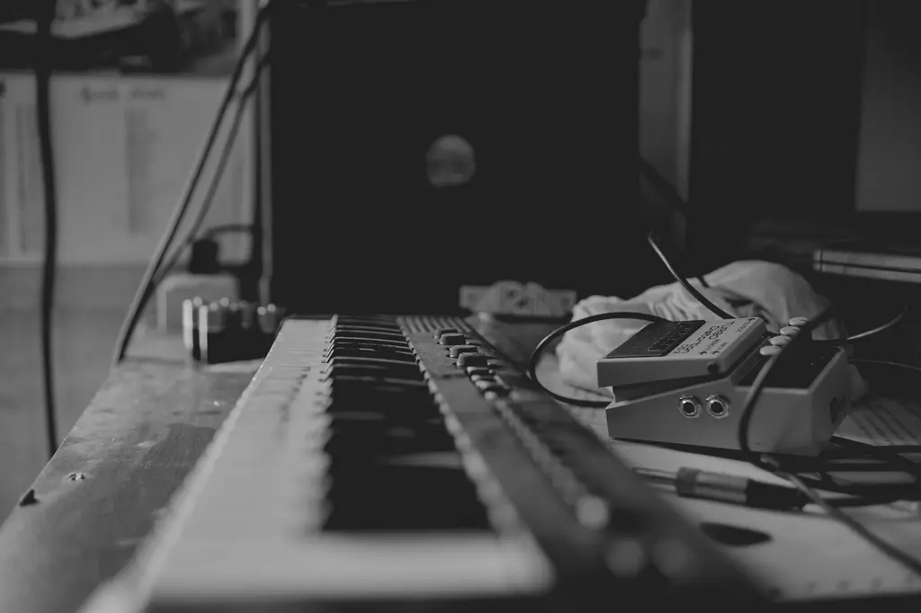 Musical instruments and music equipment arranged in a studio setting.